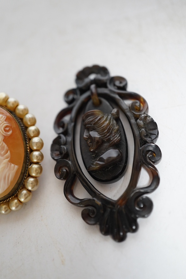 A yellow metal shell cameo ring, a brooch and a pendant. Condition - fair